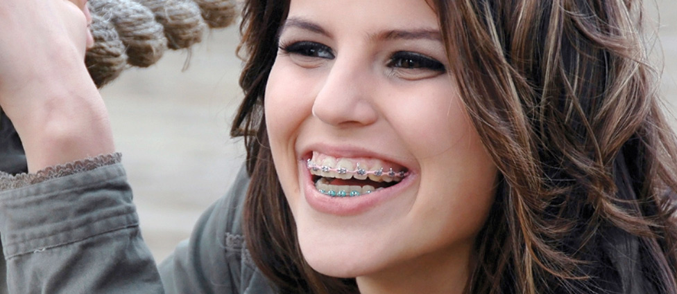 Smiling woman with braces