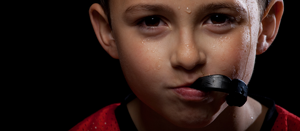 Child with sport guard in mouth
