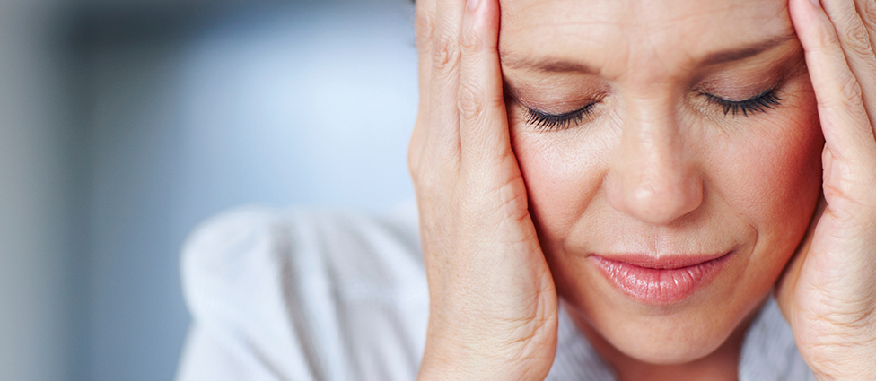 Woman suffering from headache